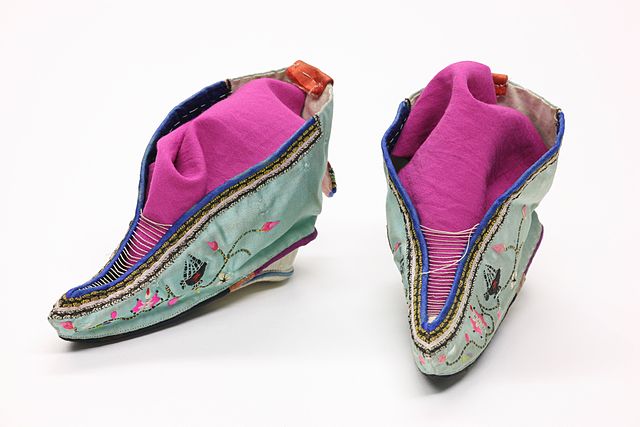 colorful shoes; 'Foot binding shoes 1in by I, Daniel Schwen. Licensed under CC BY-SA 3.0 via Wikimedia Commons - http://commons.wikimedia.org/wiki/File:Foot_binding_shoes_1.jpg#mediaviewer/File:Foot_binding_shoes_1.jpg'